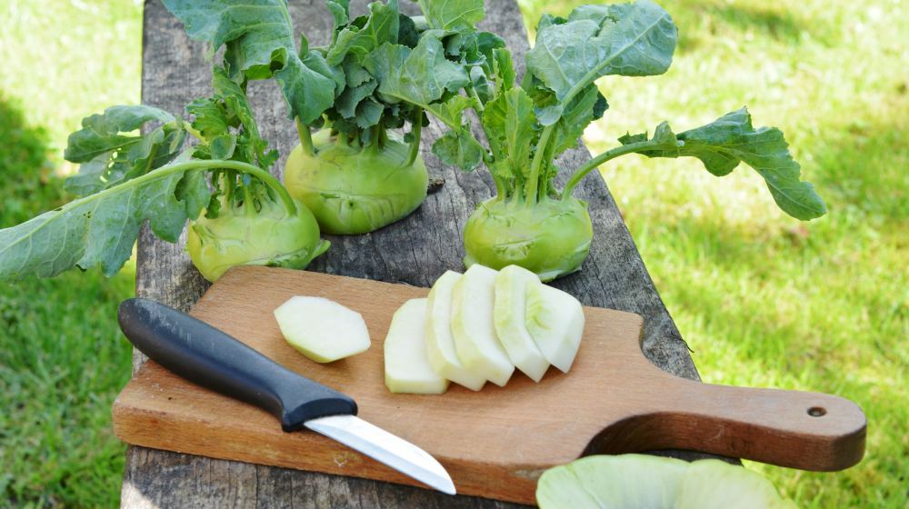 kohlrabi on wooden chopping board | Spring Vegetable Garden Plants Perfect For Spring Growing Season | vegetable garden plants | what to grow in spring