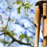 Garden decoration, wind chimes hanging in a blooming tree | Most-Liked Wind Chimes For A Sparkling Garden Year-Round | wind chimes diy | Featured