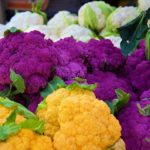 orange and purple and white cauliflower at the farmer's market | How To Grow Cauliflower In Your Backyard | how to grow cauliflower | featured