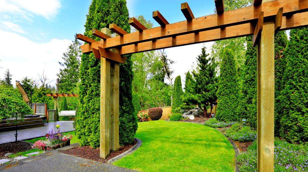 Entrance in the garden with wooden arbor | How To Build Your Own Wood Arbor For Your Fall Garden | wood arbor with gate