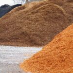 close up on colorful mulch in piles | Mulch Colors: How To Choose The Right One For Your Garden | colored mulch | featured