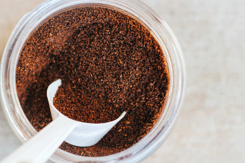 White spoon on coffee | The Best Homemade Dog Repellent For Your Garden | chili powder