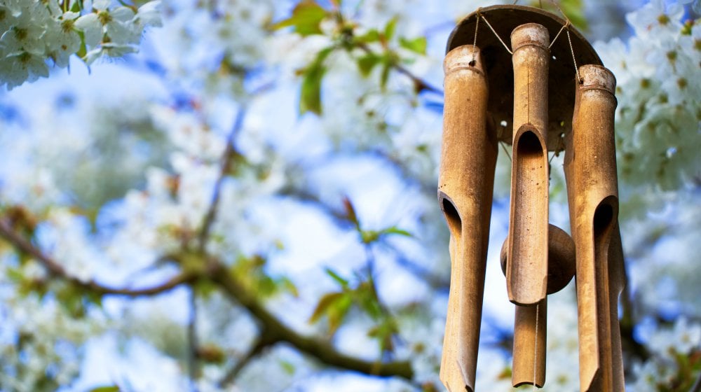 Garden decoration, wind chimes hanging in a blooming tree | Most-Liked Wind Chimes For A Sparkling Garden Year-Round | wind chimes diy | Featured