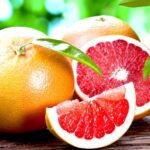 Grapefruit On Top Of Wooden Table | Growing Grapefruit From Seed in 5 Easy Steps | Featured
