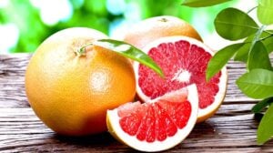 Grapefruit On Top Of Wooden Table | Growing Grapefruit From Seed in 5 Easy Steps | Featured