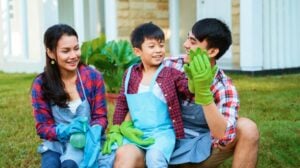 Happy gardening with family at home. planting new tree on a pot together | Fun Gardening Activities For Kids Even You Will Enjoy | gardening activities | Featured