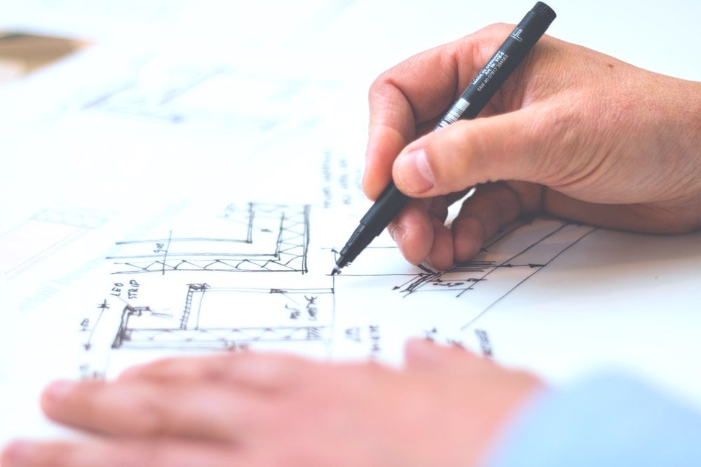 Person Holding Black Pen making a plan | How To Build a Rose Garden For Small Spaces