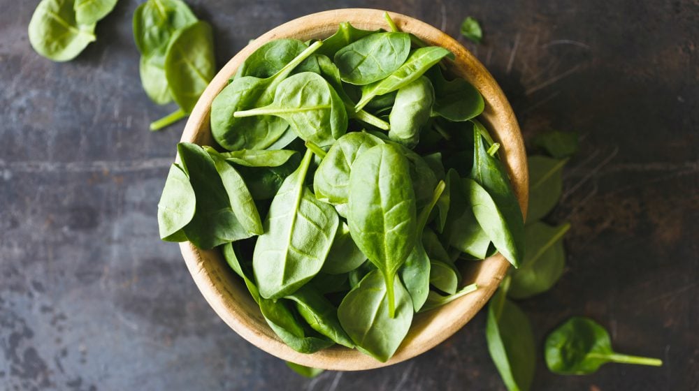 spinach in a wooden bowl | Spring Vegetable Garden Plants Perfect For Spring Growing Season | vegetable garden plants | spring vegetable garden