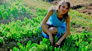 Woman Planting Crops | 10 Easy Vegetable Gardening Tips To Achieve An Abundant Harvest | Featured